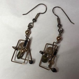 Kinetic gold and black dangles